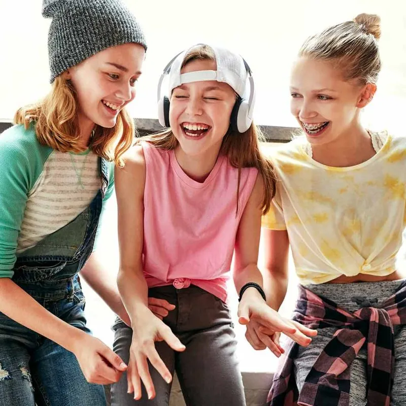 Three teens smiling